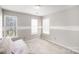 Neutral bedroom with two windows, plush carpet and light wall color at 14525 Arbor Ridge Dr, Charlotte, NC 28273