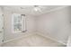 Neutral bedroom with plush carpet, large window and ceiling fan at 14525 Arbor Ridge Dr, Charlotte, NC 28273