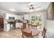 Bright kitchen with white cabinets, stainless steel appliances, granite countertops, and breakfast nook at 14525 Arbor Ridge Dr, Charlotte, NC 28273