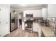 Well-lit kitchen featuring stainless steel appliances and granite countertops at 14525 Arbor Ridge Dr, Charlotte, NC 28273