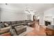 Spacious living room with hardwood floors, a fireplace, and an open archway to the dining area at 14525 Arbor Ridge Dr, Charlotte, NC 28273
