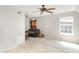 Neutral living room with a window, ceiling fan, carpet and cozy furniture at 14525 Arbor Ridge Dr, Charlotte, NC 28273
