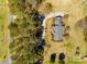 Aerial view of a well-maintained home featuring a circular driveway, mature landscaping, and a serene setting at 1515 Paul Boyd Rd, Clover, SC 29710