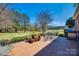 Brick patio leading to a large, well-maintained backyard under a bright blue sky at 1515 Paul Boyd Rd, Clover, SC 29710