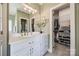 Bathroom featuring double vanity, framed mirror, and a walk-in closet at 1515 Paul Boyd Rd, Clover, SC 29710