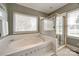 Bathroom featuring an expansive soaking tub and glass enclosed shower at 1515 Paul Boyd Rd, Clover, SC 29710
