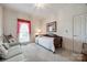 Bright bedroom with natural light, neutral decor, and a cozy daybed at 1515 Paul Boyd Rd, Clover, SC 29710