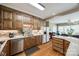 Well-equipped kitchen featuring wooden cabinetry and stainless steel appliances at 1515 Paul Boyd Rd, Clover, SC 29710