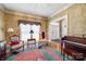 Elegant living room featuring hardwood floors, a piano, and a view of the front foyer at 1515 Paul Boyd Rd, Clover, SC 29710