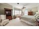 Spacious main bedroom with sitting area, large windows, and a ceiling fan at 1515 Paul Boyd Rd, Clover, SC 29710