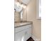 Bathroom vanity featuring granite countertops, framed mirror, and brushed nickel faucet and fixtures at 1587 Green Circle Dr, Gastonia, NC 28054