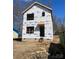 New construction shows the exterior of the house with protective moisture barrier material installed and awaiting cladding at 1587 Green Circle Dr, Gastonia, NC 28054