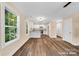 Sun-filled living space showcasing natural light with an open layout leading into the modern kitchen at 1587 Green Circle Dr, Gastonia, NC 28054