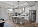 Bright kitchen with a white marble island, stainless appliances, and modern pendant lighting at 1925 Hendricks St, Rock Hill, SC 29732