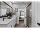 A luxurious bathroom features a double sink vanity and an adjoining shower at 1925 Hendricks St, Rock Hill, SC 29732
