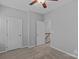 Neutral bedroom features carpeted floors, closet, and door to stairs at 19737 Playwrights Way, Cornelius, NC 28031