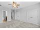 Large bedroom with carpet, ceiling fan, closet, and ensuite bathroom access at 19737 Playwrights Way, Cornelius, NC 28031