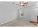 Bright bedroom with neutral carpet and a ceiling fan, ready for personalization at 19737 Playwrights Way, Cornelius, NC 28031