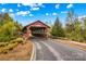 Charming covered bridge near a community park with green landscape and blue skies at 19737 Playwrights Way, Cornelius, NC 28031
