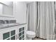 Clean bathroom with a patterned shower curtain, modern sink, and white vanity at 201 Riverview Ter, Lake Wylie, SC 29710