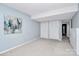 Light-filled bedroom featuring neutral walls and flooring with a double closet at 201 Riverview Ter, Lake Wylie, SC 29710