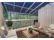 Relaxing deck with patio furniture shaded by a retractable awning overlooking mature trees at 201 Riverview Ter, Lake Wylie, SC 29710