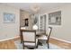 Charming dining area features hardwood floors, modern lighting, and a view to the kitchen at 201 Riverview Ter, Lake Wylie, SC 29710