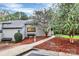 Inviting home exterior with manicured landscaping, a well-lit walkway, and mature trees at 201 Riverview Ter, Lake Wylie, SC 29710