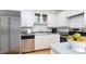 Modern kitchen with stainless steel appliances, white cabinetry, and light countertops at 201 Riverview Ter, Lake Wylie, SC 29710