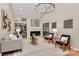 Sunlit living room featuring a fireplace, hardwood floors, and sliding door access at 201 Riverview Ter, Lake Wylie, SC 29710