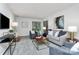 Spacious living room with contemporary furnishings, neutral paint and large windows at 201 Riverview Ter, Lake Wylie, SC 29710