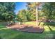 Community playground with swings, slides, and various play structures on green grass at 201 Riverview Ter, Lake Wylie, SC 29710