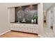 Entertaining wet bar features cabinetry, a sink, granite countertop, and hardwood floors at 201 Riverview Ter, Lake Wylie, SC 29710