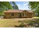 Beautiful backyard highlighting the home's exterior, and a wooden fence for privacy and security at 2014 Cardinal Loop, Stanley, NC 28164