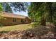 Extensive backyard with a playset, partially fenced, providing a safe and enjoyable outdoor space at 2014 Cardinal Loop, Stanley, NC 28164
