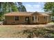 Well-maintained backyard showing the home's exterior, patio, and a wood fence, creating a private oasis at 2014 Cardinal Loop, Stanley, NC 28164