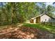 Wide backyard with a wooden playset and a sturdy wood fence, ideal for Gathering enjoyment at 2014 Cardinal Loop, Stanley, NC 28164
