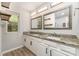 Bathroom with double sink vanity, granite counters, and framed mirrors at 2014 Cardinal Loop, Stanley, NC 28164