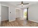 Bedroom featuring ceiling fan, closet and a large window with backyard view at 2014 Cardinal Loop, Stanley, NC 28164