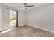 Bedroom with ceiling fan, wood floors and a sun-filled window with backyard view at 2014 Cardinal Loop, Stanley, NC 28164