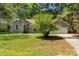 Attractive home with lovely landscaping and an attached garage, blending comfort and style seamlessly at 2014 Cardinal Loop, Stanley, NC 28164