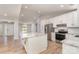 Beautiful kitchen with white cabinets, stainless steel appliances, granite countertops, and a kitchen island at 2014 Cardinal Loop, Stanley, NC 28164