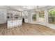 Bright kitchen features stainless steel appliances, white cabinets, granite countertops, and an adjacent dining area at 2014 Cardinal Loop, Stanley, NC 28164