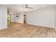 Spacious living room with wood-look flooring, neutral walls, and a ceiling fan, designed for comfort and relaxation at 2014 Cardinal Loop, Stanley, NC 28164