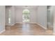 Bright, airy living room with wood floors and a large arched window at 2014 Cardinal Loop, Stanley, NC 28164