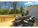 Inviting back deck with stylish outdoor furniture, perfect for entertaining and relaxation at 215 Wyanoke Ave, Charlotte, NC 28205