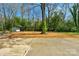 Spacious backyard with a storage shed and mature trees, offering privacy and serenity at 215 Wyanoke Ave, Charlotte, NC 28205