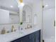 Modern bathroom with double sinks, marble countertops, and sleek fixtures, providing a luxurious experience at 215 Wyanoke Ave, Charlotte, NC 28205