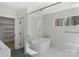 Elegant bathroom featuring a freestanding tub, glass-enclosed shower, and stylish tile work at 215 Wyanoke Ave, Charlotte, NC 28205