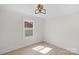 Bright bedroom with natural light and hardwood floors at 215 Wyanoke Ave, Charlotte, NC 28205